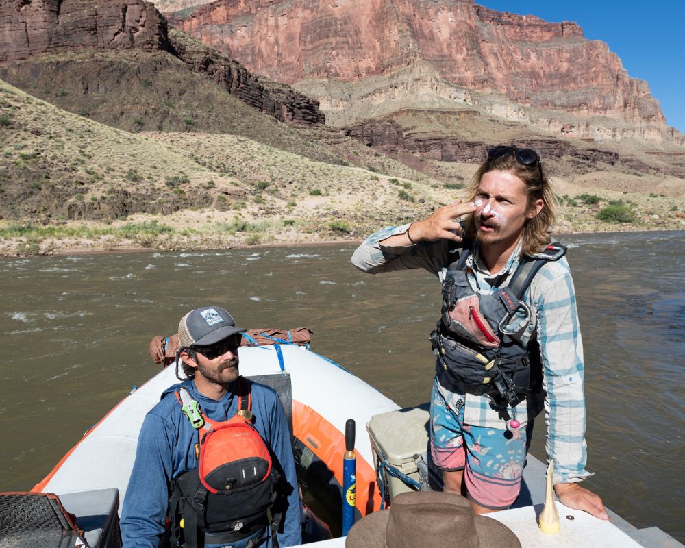 hatch guides applying water safe sunscreen on a river trip