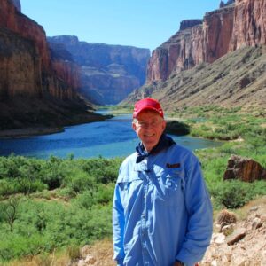 A man, Ed Lowry, stands in Grand Canyon near the Colorado River in the Nankoweap area. He took 53 trips down the canyon, more than some swampers.