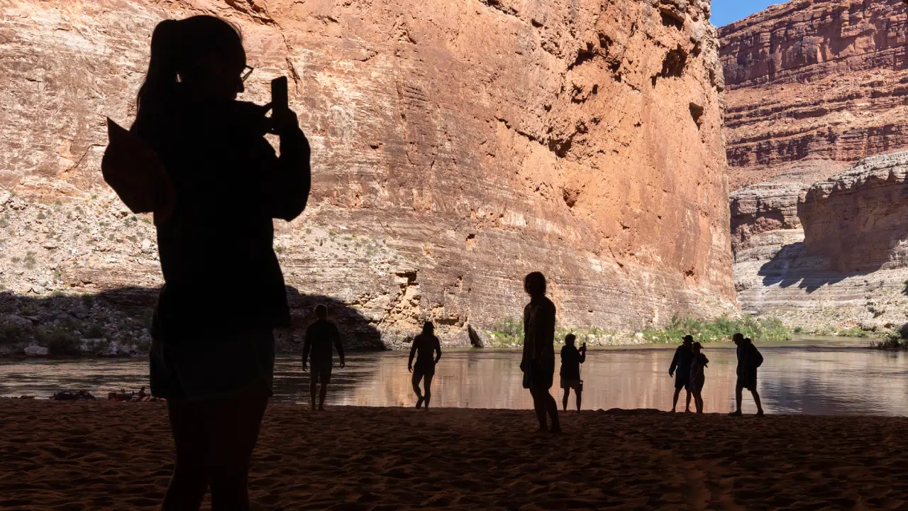 Silhouette of people standing on Grand Canyon trip with Hatch River Expeditions