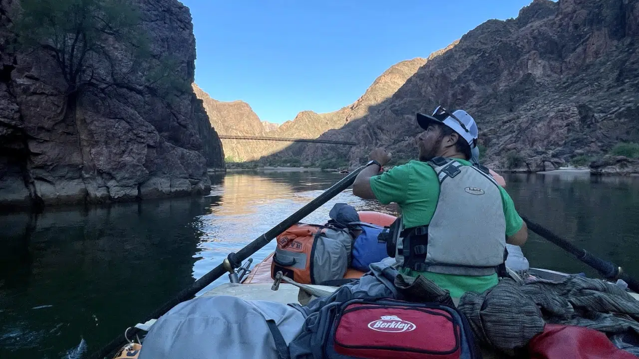 Guide from Hatch River Expeditions Rowing boat on Colorado River for guests