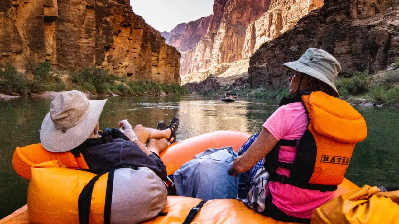 People on boat, smooth water of Colorado River