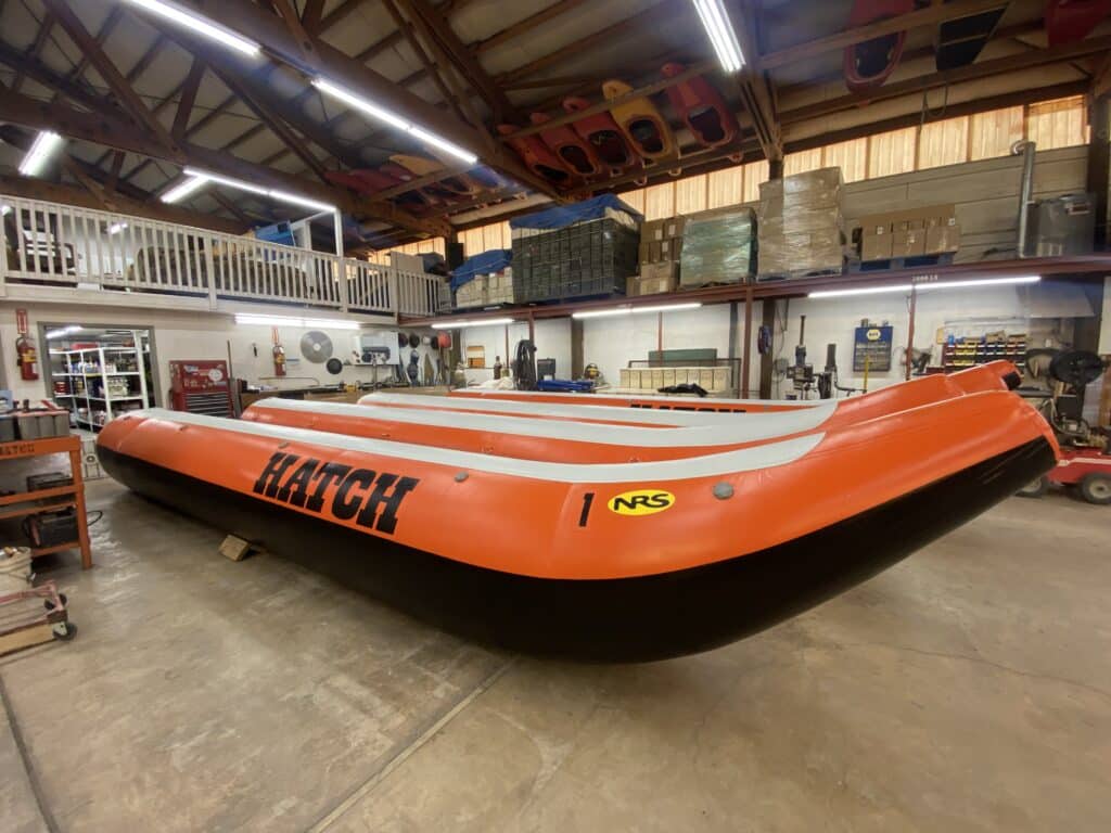 New orange side tubes for a motorized river raft sit in the Hatch River Expeditions warehouse.