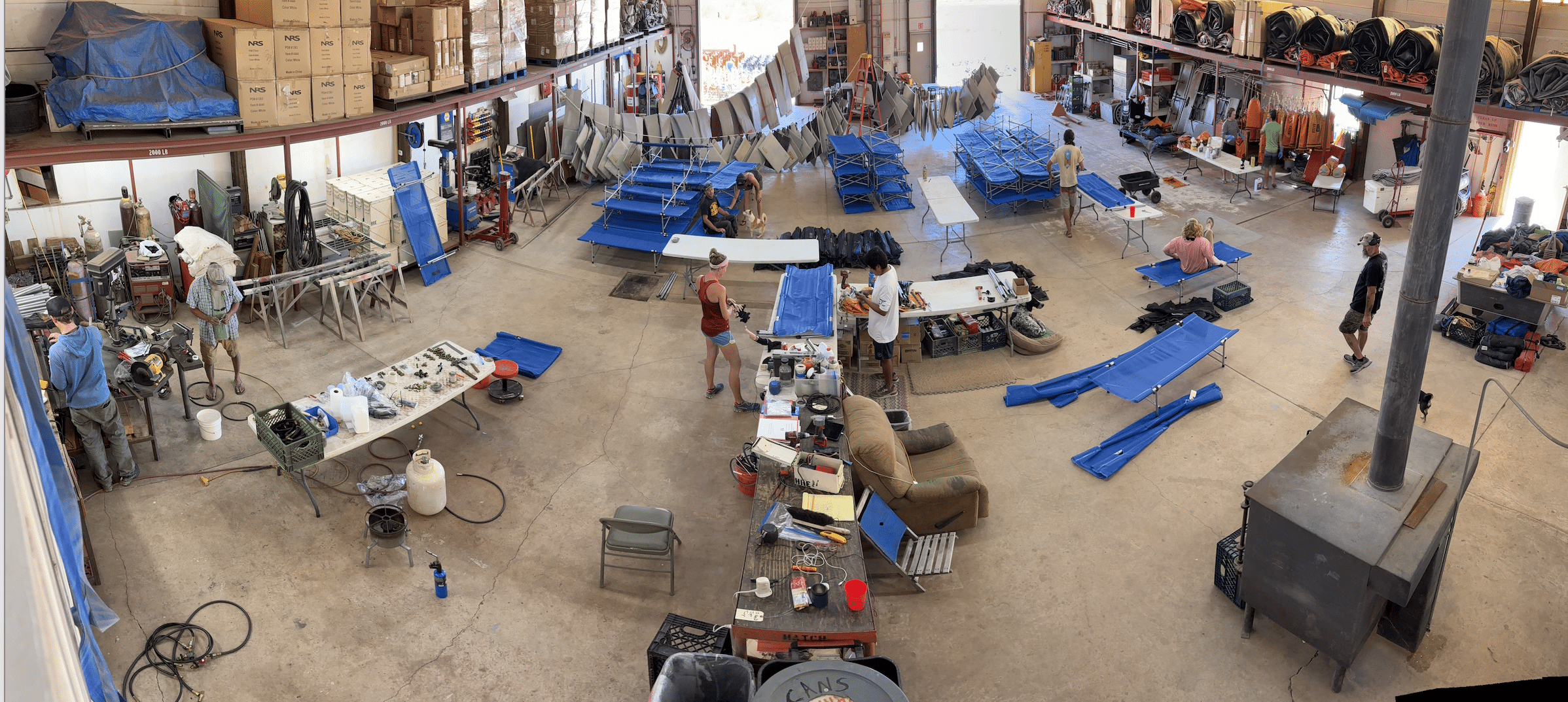 Repairs on cots, sleeping pad, and stoves are made being made during winter work in the warehouse at Hatch River Expeditions