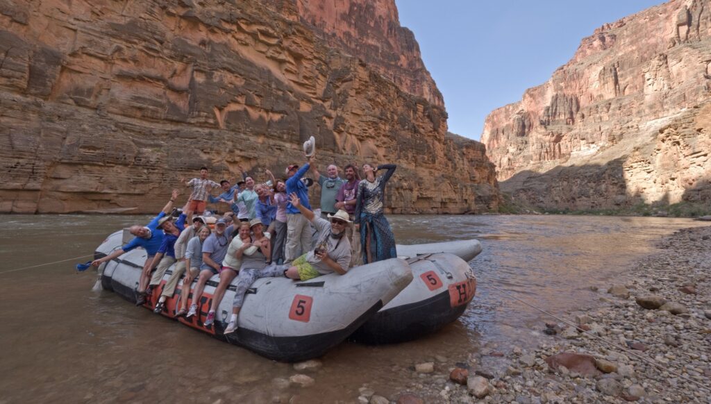 Guests pose on Hatch Boat