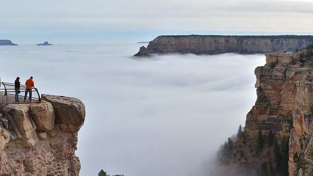 Photo of a cloud inversion event viewed from the Grand Canyon South Rim where the clouds settle below the rim of the canyon