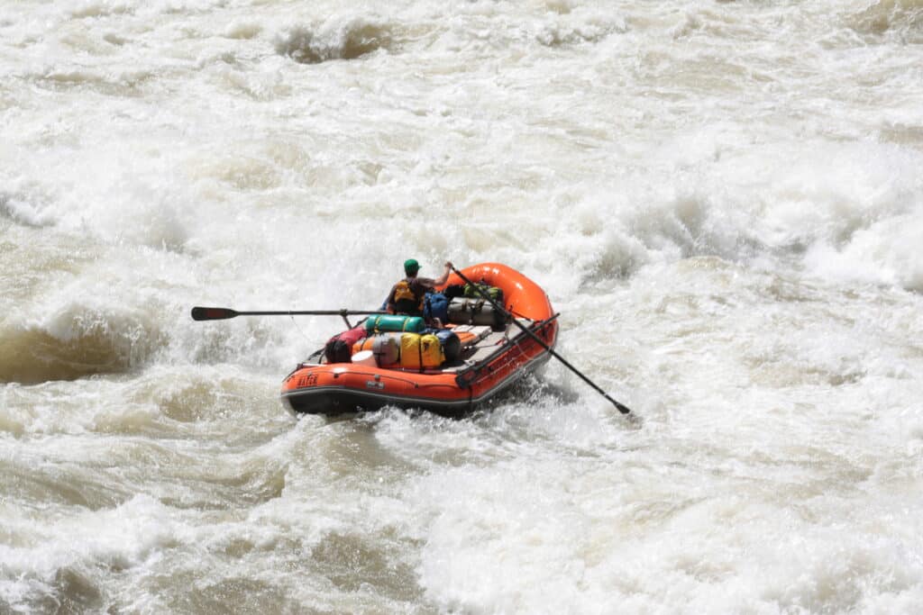 Oar boat in rapid