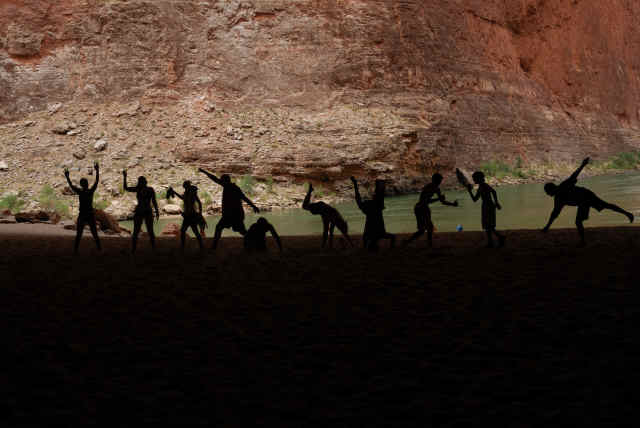 10 Hatch guests pose for a silhouette photo in Redwall Cavern on a recent trip. 