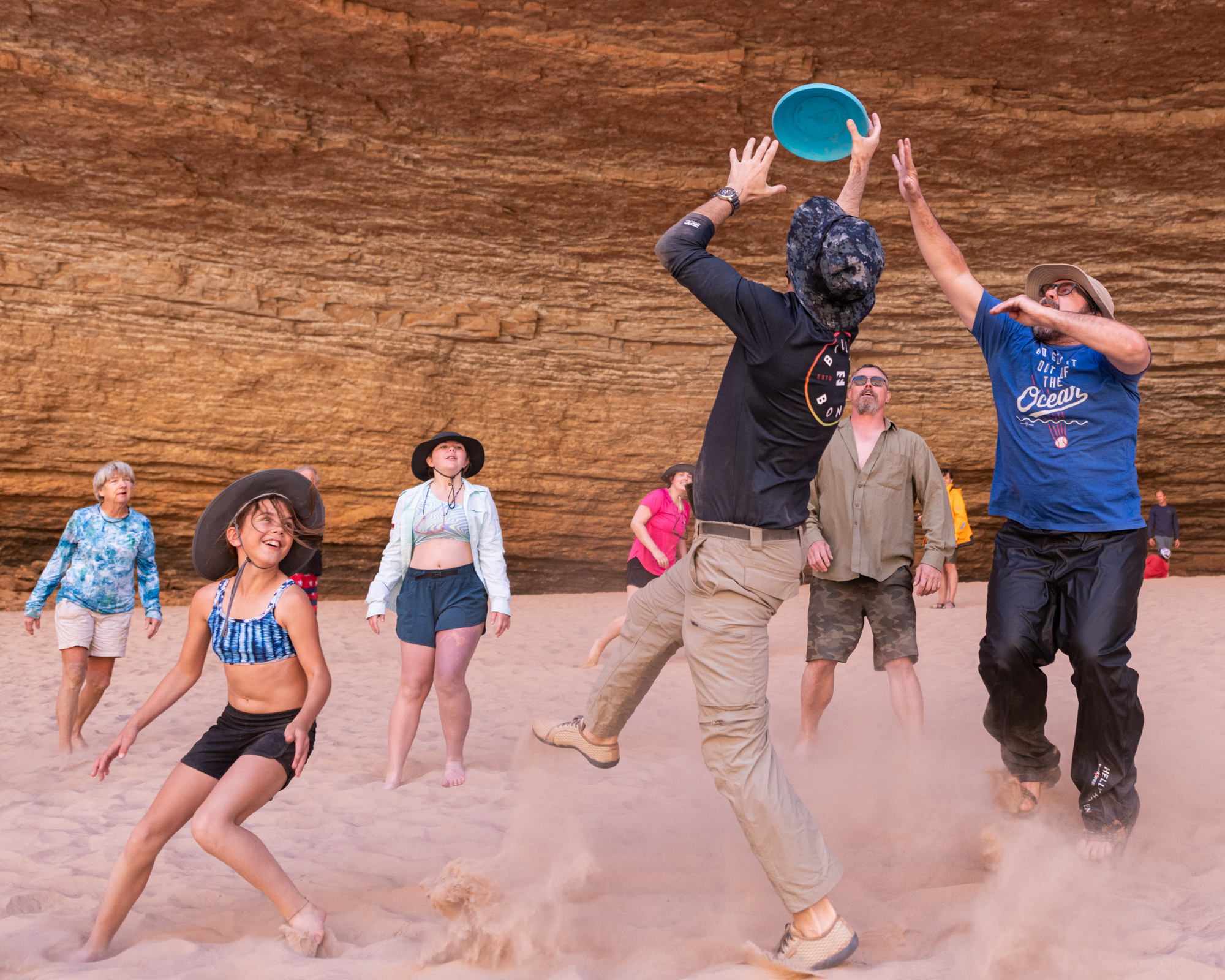 Family plays frisbee on Hatch river trip