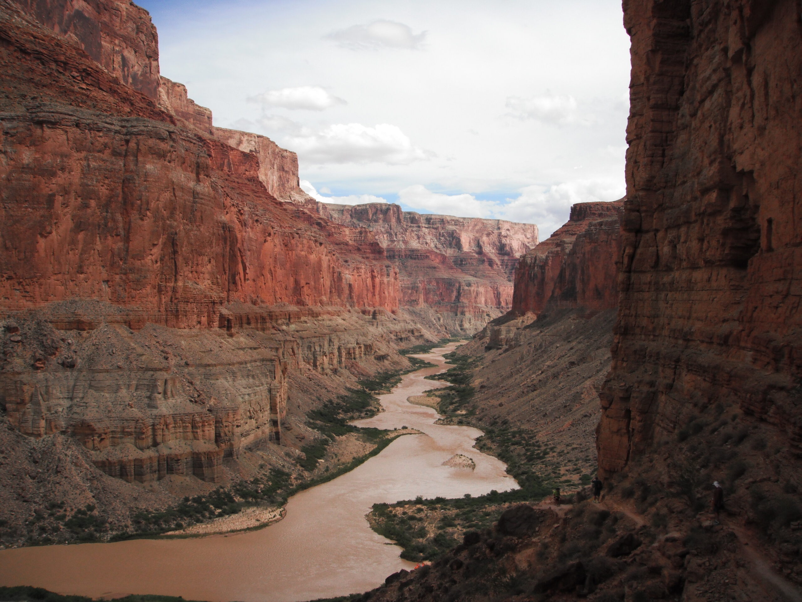The Colorado River changes color from blue-green to this brown seen from Nankoweap. Photo credit: Jon Hauris.