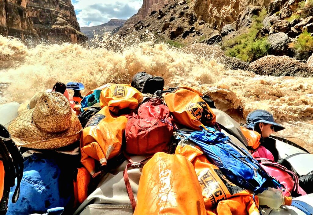 Day bags on duffel pile going through rapid Credit: Victor Linares 