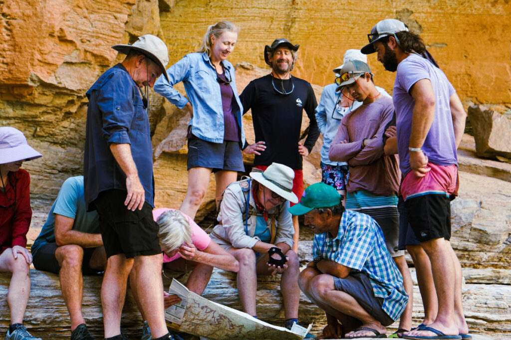 Guests gathered around guide and map credit: Kelsey Pfendler 