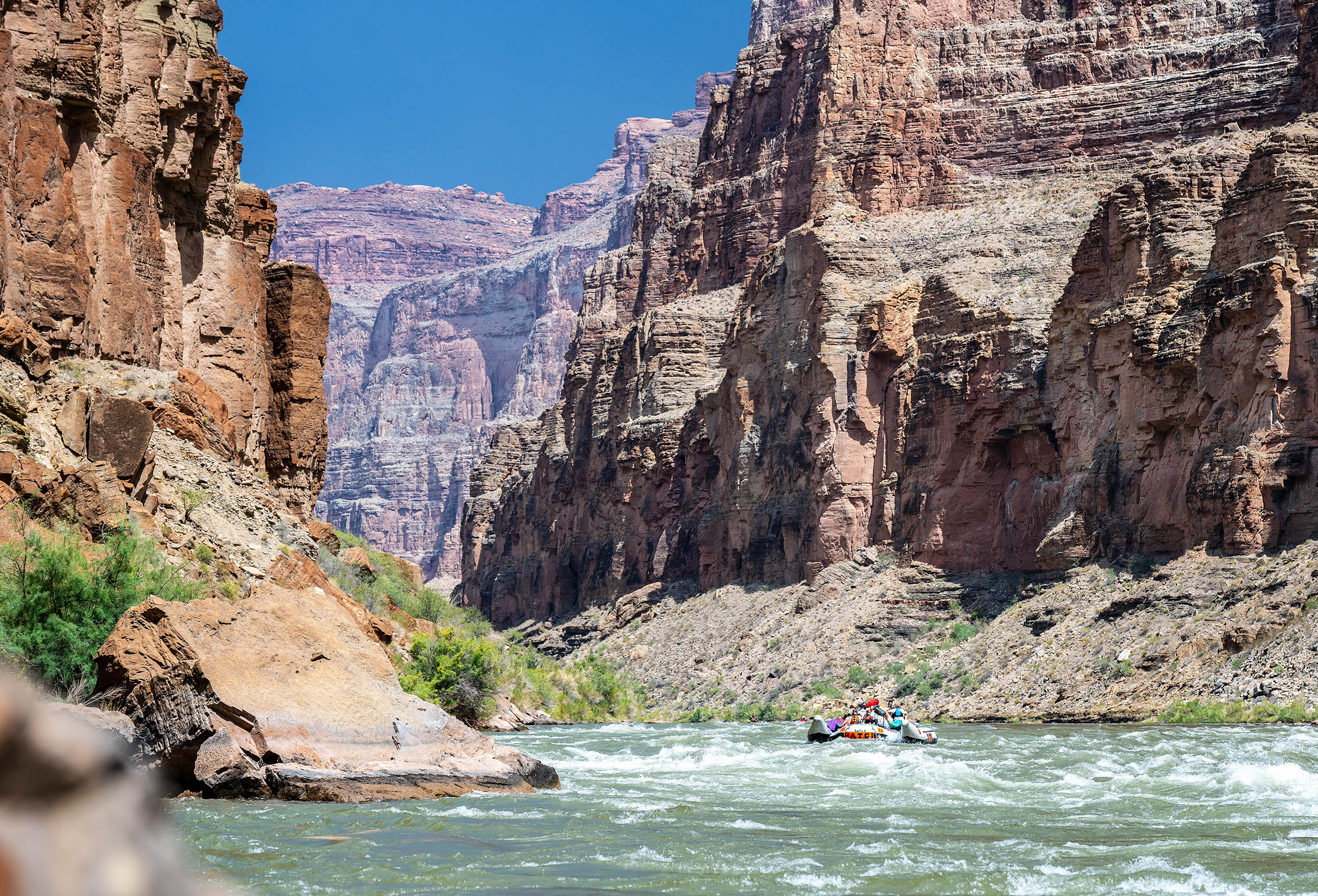 A Hatch raft makes its way down the Colorado River, helping people experience the best way to see the Grand Canyon. Photo credit: Michael Neumann.