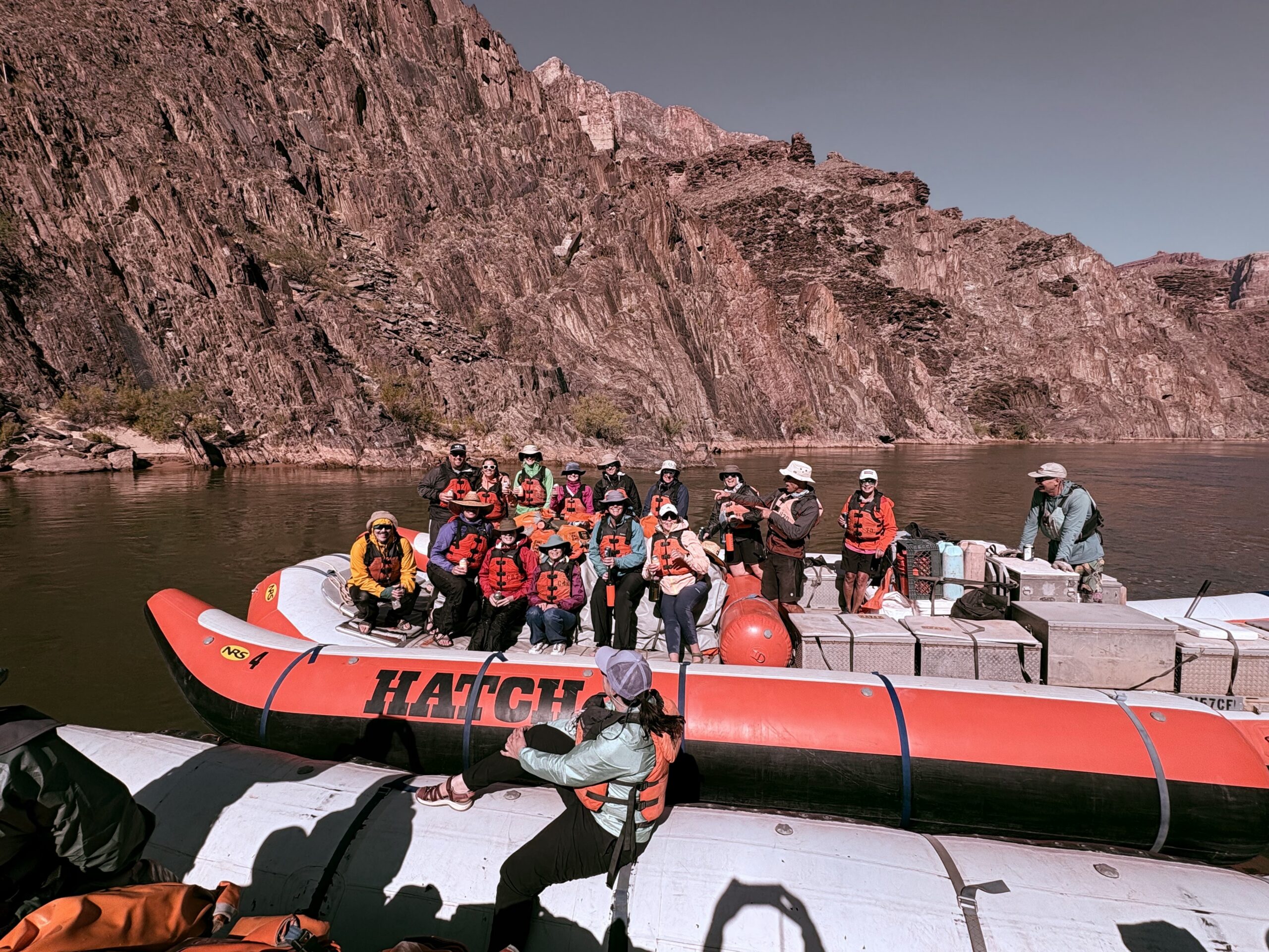 Guests gather on a Hatch boat to pose for a photo during their Grand Canyon rafting trip. Photo credit: Andy Hawk.