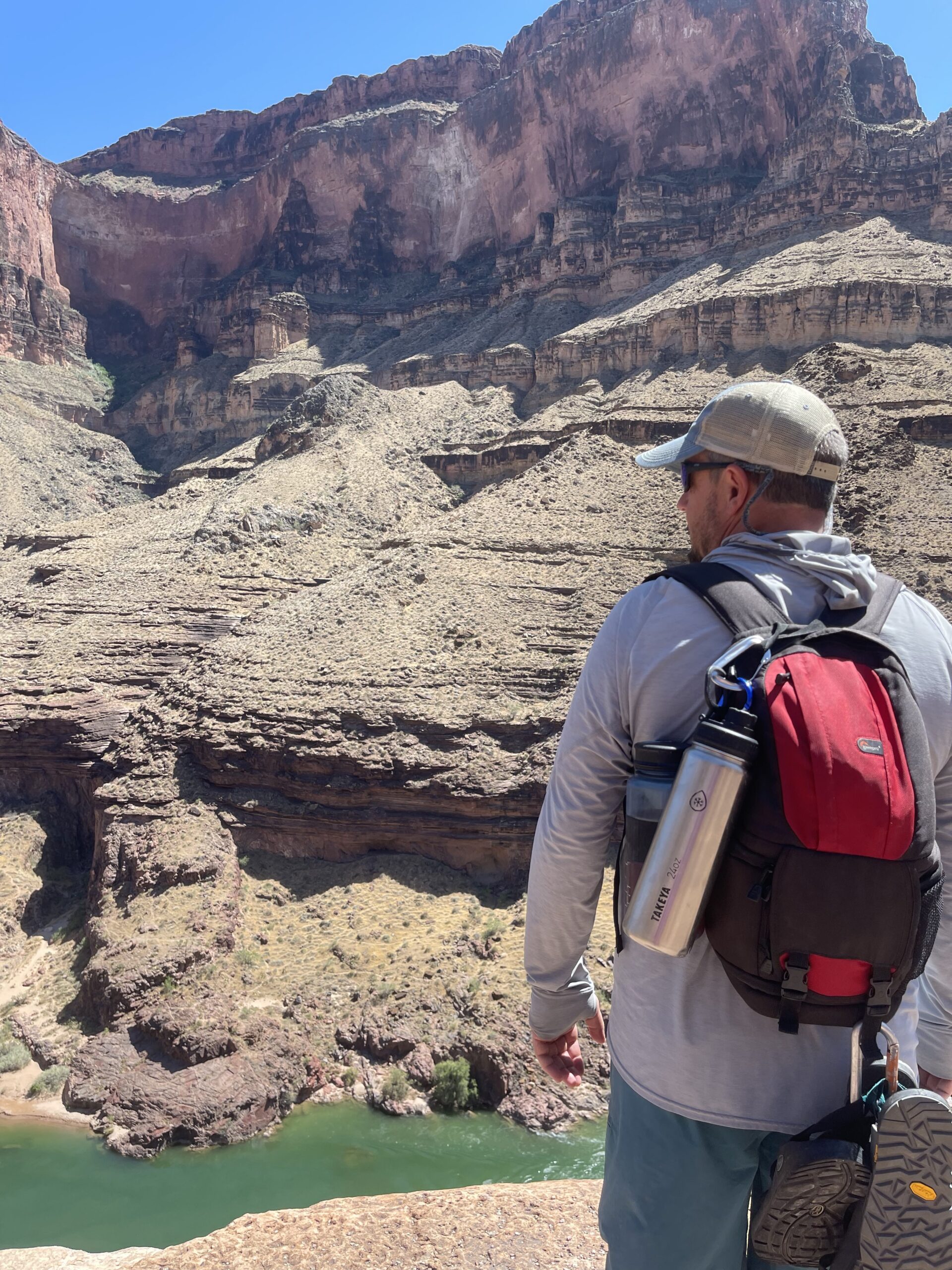 A Hatch guest on a Grand Canyon hike has a water bottle clipped to his backpack. Photo credit: John Dillon.