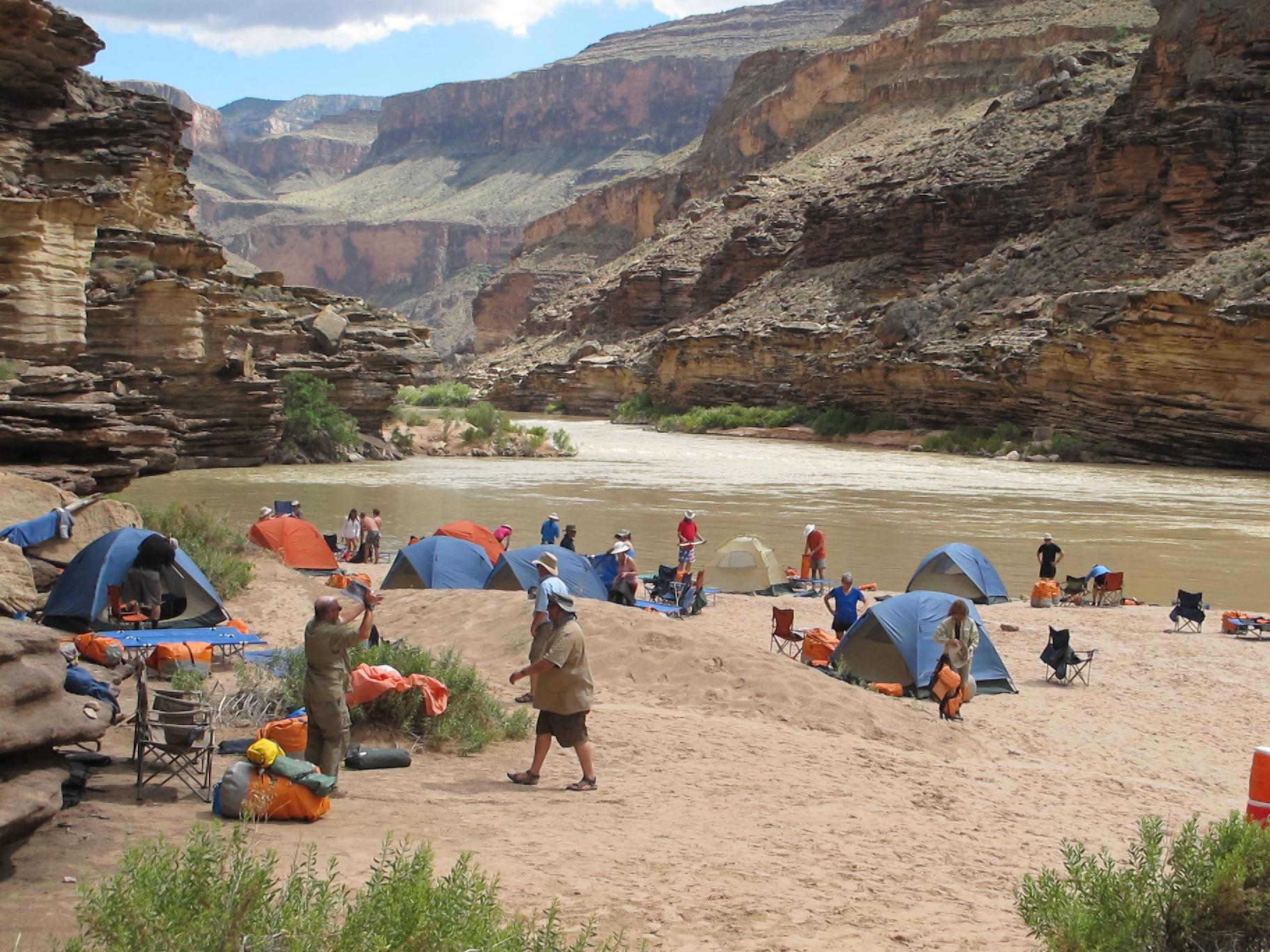 What’s It Like Camping with Hatch During Your Rafting Trip? 1 Camping with Hatch might involve spreading tents and cots across a big sandy beach like in this photo. Photo credit: Ken Askelson.