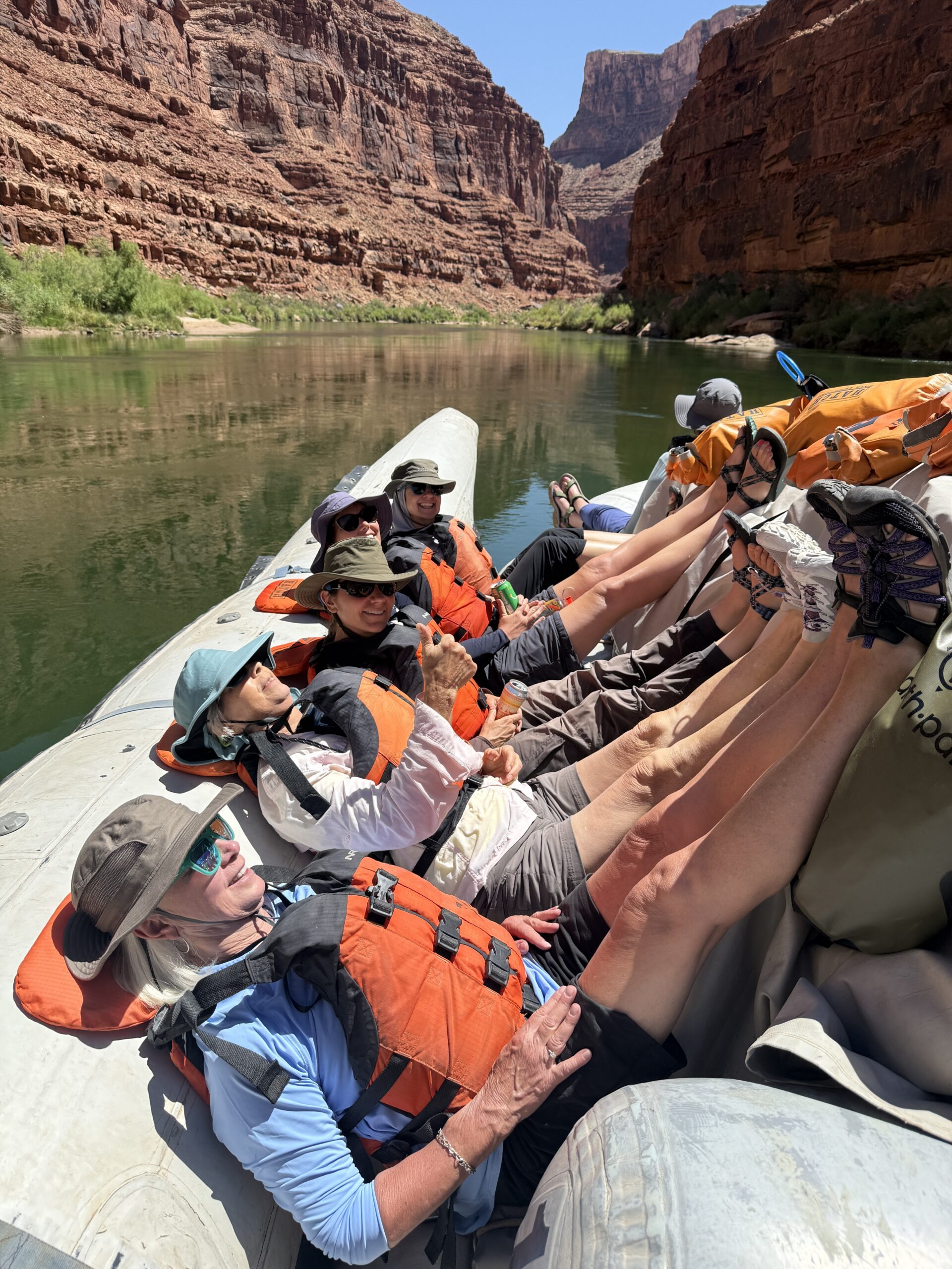 Guests put their feet up in the flatwater while rafting with Hatch. Photo credit: Andy Hawk.
