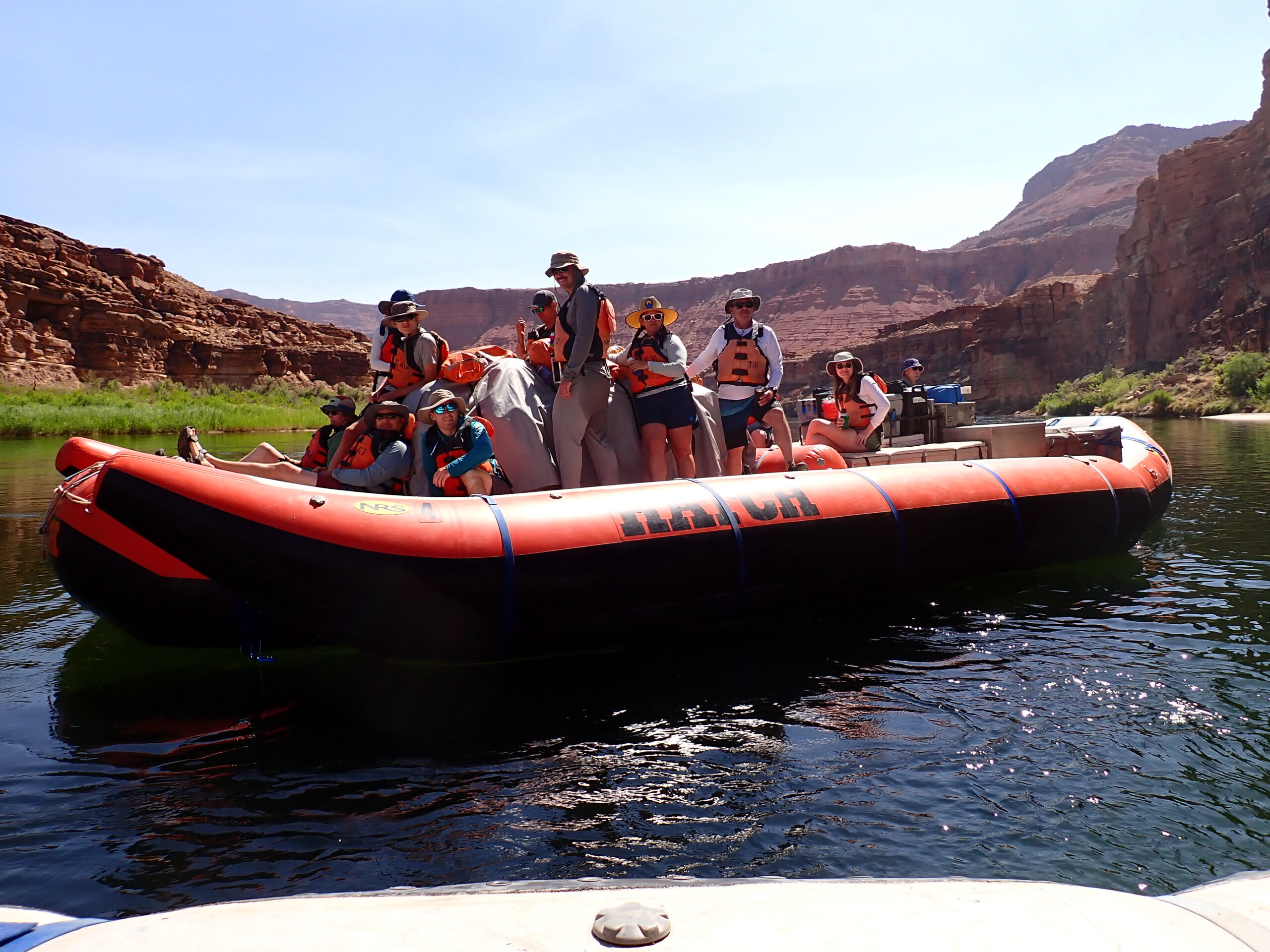 An orange Hatch rafting floating down the Colorado River. Photo credit: Andy Hawk.
