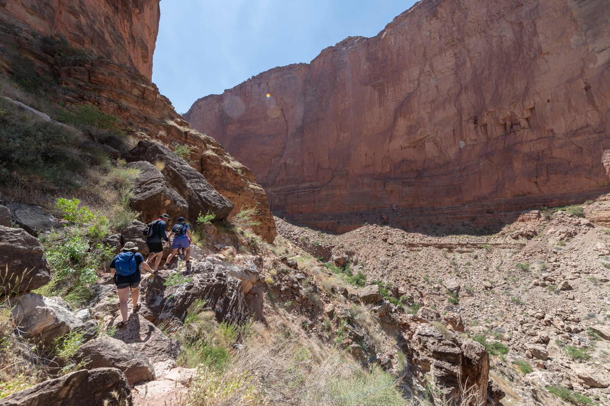 Hatch guests hiking a steep rocky trail in the Grand Canyon